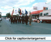 A color gaurd participates in the 1991 Acadian Festival annual parade. The solitary soldier in camoflage represents the troops serving in Operation Desert Storm.