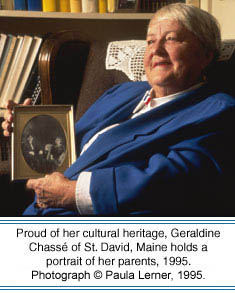Proud of her cultural heritage, Geraldine Chassé of St. David, Maine holds a portrait of her parents, 1995. Photographer: Paula Lerner,   2003.
